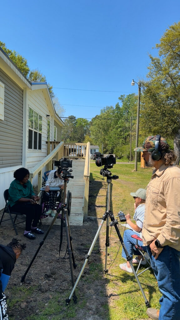 Behind-the-scenes shot of the crew and filming setup